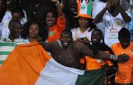 CASABLANCA, MOROCCO - NOVEMBER 16: Ivory Coast fans celebrate after the FIFA 2014 World Cup Qualifier Play-off Second Leg between Senegal and Ivory Coast at Stade Mohammed V on November 16, 2013 in Casablanca, Morocco. (Photo by Mike Hewitt/Getty Images)