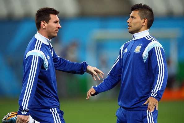 SAO PAULO, BRAZIL - JULY 08:  (L-R) Lionel Messi and Sergio Aguero stretch during a training session at Arena de Sao Paulo on July 8, 2014 in Sao Paulo, Brazil.  (Photo by Ronald Martinez/Getty Images)