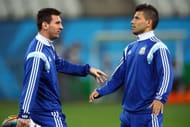 SAO PAULO, BRAZIL - JULY 08: (L-R) Lionel Messi and Sergio Aguero stretch during a training session at Arena de Sao Paulo on July 8, 2014 in Sao Paulo, Brazil. (Photo by Ronald Martinez/Getty Images)
