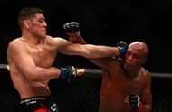 LAS VEGAS, NV - JANUARY 31: Nick Diaz (L) and Anderson Silva trade punches in their middleweight bout during UFC 183 at the MGM Grand Garden Arena on January 31, 2015 in Las Vegas, Nevada. Silva won by unanimous decision. (Photo by Steve Marcus/Getty Images)