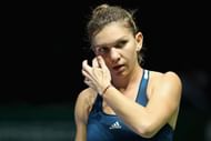 SINGAPORE - OCTOBER 27: Simona Halep of Romania reacts in her singles match against Dominika Cibulkova of Slovakia during day 5 of the BNP Paribas WTA Finals Singapore at Singapore Sports Hub on October 27, 2016 in Singapore. (Photo by Matthew Stockman/Getty Images for WTA)