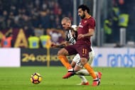 TURIN, ITALY - DECEMBER 17: Stefano Sturaro (L) of Juventus FC competes with Mohamed Salah of AS Roma during the Serie A match between Juventus FC and AS Roma at Juventus Stadium on December 17, 2016 in Turin, Italy. (Photo by Valerio Pennicino/Getty Images)