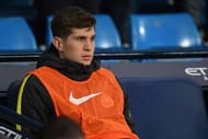 MANCHESTER, ENGLAND - DECEMBER 18: John Stones of Manchester City looks on from his seat on the Manchester City bench during the Premier League match between Manchester City and Arsenal at the Etihad Stadium on December 18, 2016 in Manchester, England. (Photo by Michael Regan/Getty Images)