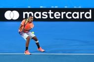 PERTH, AUSTRALIA - JANUARY 01: Nick Kyrgios of Australia partnered with Daria Gavrilova plays a backhand during their match against Lara Arruabarrena and Feliciano Lopez of Spain on day one of the 2017 Hopman Cup at Perth Arena on January 1, 2017 in Perth, Australia. (Photo by Paul Kane/Getty Images)