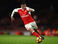 LONDON, ENGLAND - JANUARY 01: Alexis Sanchez of Arsenal runs with the ball during the Premier League match between Arsenal and Crystal Palace at the Emirates Stadium on January 1, 2017 in London, England. (Photo by Clive Mason/Getty Images)