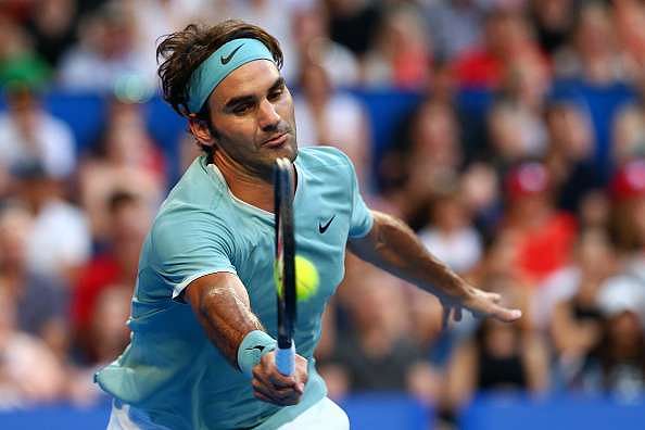 PERTH, AUSTRALIA - JANUARY 02: Roger Federer of Switzerland plays a forehand to Dan Evans of Great Britain in the men&#039;s singles match on day two of the 2017 Hopman Cup at Perth Arena on January 2, 2017 in Perth, Australia.  (Photo by Paul Kane/Getty Images)