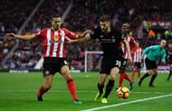SUNDERLAND, ENGLAND - JANUARY 02: Jack Rodwell of Sunderland (L) and Adam Lallana of Liverpool (R) battle for possession during the Premier League match between Sunderland and Liverpool at Stadium of Light on January 2, 2017 in Sunderland, England. (Photo by Stu Forster/Getty Images)