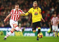STOKE ON TRENT, ENGLAND - JANUARY 03: Charlie Adam of Stoke City shoots while Valon Behrami of Watford tries to block during the Premier League match between Stoke City and Watford at Bet365 Stadium on January 3, 2017 in Stoke on Trent, England. (Photo by Clive Brunskill/Getty Images)