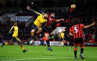 BOURNEMOUTH, ENGLAND - JANUARY 03: Olivier Giroud of Arsenal and Steve Cook of AFC Bournemouth compete for the ball during the Premier League match between AFC Bournemouth and Arsenal at Vitality Stadium on January 3, 2017 in Bournemouth, England. (Photo by Michael Steele/Getty Images)