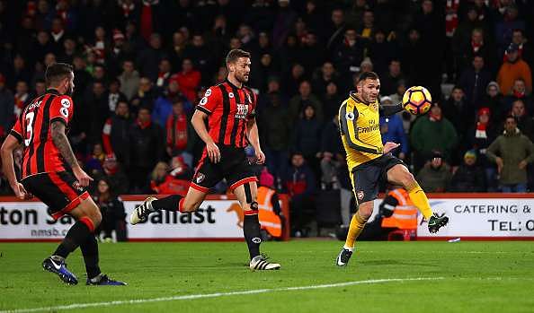 BOURNEMOUTH, ENGLAND - JANUARY 03:  Lucas Perez (R) of Arsenal scores his side&#039;s second goal  during the Premier League match between AFC Bournemouth and Arsenal at Vitality Stadium on January 3, 2017 in Bournemouth, England.  (Photo by Michael Steele/Getty Images)