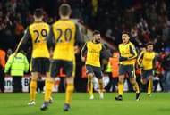 BOURNEMOUTH, ENGLAND - JANUARY 03: Olivier Giroud (3rd L) of Arsenal celebrates scoring his team's third goal with his team mate Alexis Sanchez (2nd R) during the Premier League match between AFC Bournemouth and Arsenal at Vitality Stadium on January 3, 2017 in Bournemouth, England. (Photo by Warren Little/Getty Images)
