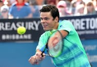 BRISBANE, AUSTRALIA - JANUARY 07: Milos Raonic of Canada plays a backhand against Grigor Dimitrov of Bulgaria during their semi final match on day seven of the 2017 Brisbane International at Pat Rafter Arena on January 7, 2017 in Brisbane, Australia. (Photo by Bradley Kanaris/Getty Images)