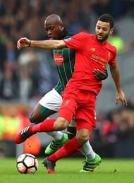 LIVERPOOL, ENGLAND - JANUARY 08: Arnold Garita of Plymouth Argyle (L) and Kevin Stewart of Liverpool (R) battle for possession during The Emirates FA Cup Third Round match between Liverpool and Plymouth Argyle at Anfield on January 8, 2017 in Liverpool, England. (Photo by Michael Steele/Getty Images)