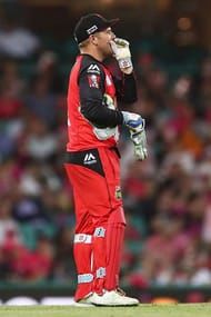 SYDNEY, AUSTRALIA - JANUARY 09: Aaron Finch of the Renegades places on keepers pads to replace team mate Peter Nevill after Nevill took a knock to the head from a skidding ball during the Big Bash League match between the Sydney Sixers and the Melbourne Renegades at Sydney Cricket Ground on January 9, 2017 in Sydney, Australia. (Photo by Brendon Thorne/Getty Images)