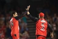 MELBOURNE, AUSTRALIA - JANUARY 12: Sunil Narine of the Renegades celebrates with Aaron Finch of the Renegades after taking a wicket during the Big Bash League match between the Melbourne Renegades and the Hobart Hurricanes at Etihad Stadium on January 12, 2017 in Melbourne, Australia. (Photo by Scott Barbour/Getty Images)