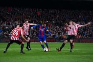 BARCELONA, SPAIN - JANUARY 11: Lionel Messi of FC Barcelona competes for the ball with Athletic Club players during the Copa del Rey round of 16 second leg match between FC Barcelona and Athletic Club at Camp Nou on January 11, 2017 in Barcelona, Spain. (Photo by David Ramos/Getty Images)