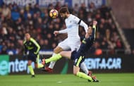SWANSEA, WALES - JANUARY 14: Fernando Llorente of Swansea City heads the ball while Laurent Koscielny of Arsenal (R) attempts to tackle him during the Premier League match between Swansea City and Arsenal at Liberty Stadium on January 14, 2017 in Swansea, Wales. (Photo by Tony Marshall/Getty Images)