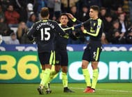 SWANSEA, WALES - JANUARY 14: Alexis Sanchez of Arsenal celebrates scoring his sides fourth goal with Alex Oxlade-Chamberlain of Arsenal (L) and Gabriel of Arsenal (R) during the Premier League match between Swansea City and Arsenal at Liberty Stadium on January 14, 2017 in Swansea, Wales. (Photo by Tony Marshall/Getty Images)