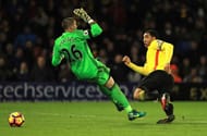 WATFORD, ENGLAND - JANUARY 14: Troy Deeney of Watford (R) shoots and Victor Valdes of Middlesbrough (L) attempts to save during the Premier League match between Watford and Middlesbrough at Vicarage Road on January 14, 2017 in Watford, England. (Photo by Richard Heathcote/Getty Images)