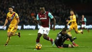 LONDON, ENGLAND - JANUARY 14: Michail Antonio of West Ham United (C) takes the ball past Wayne Hennessey of Crystal Palace (R) during the Premier League match between West Ham United and Crystal Palace at London Stadium on January 14, 2017 in London, England. (Photo by Bryn Lennon/Getty Images)