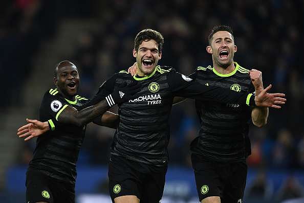 LEICESTER, ENGLAND - JANUARY 14:  Marcos Alonso of Chelsea celebrates his second goal alongside Victor Moses (L) and Gary Cahill (R) during the Premier League match between Leicester City and Chelsea at The King Power Stadium on January 14, 2017 in Leicester, England.  (Photo by Laurence Griffiths/Getty Images)