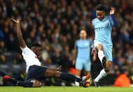 MANCHESTER, ENGLAND - JANUARY 21: Victor Wanyama of Tottenham Hotspur (L) tackles Raheem Sterling of Manchester City (R) during the Premier League match between Manchester City and Tottenham Hotspur at the Etihad Stadium on January 21, 2017 in Manchester, England. (Photo by Clive Mason/Getty Images)