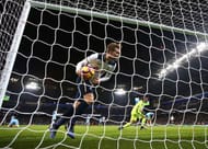 MANCHESTER, ENGLAND - JANUARY 21: Christian Eriksen of Tottenham Hotspur picks the ball out of the net as his side score their first goal during the Premier League match between Manchester City and Tottenham Hotspur at the Etihad Stadium on January 21, 2017 in Manchester, England. (Photo by Clive Mason/Getty Images)