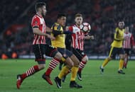 SOUTHAMPTON, ENGLAND - JANUARY 28: Alexis Sanchez of Arsenal challenges for the ball with Sam McQueen (L) of Southampton during the Emirates FA Cup Fourth Round match between Southampton and Arsenal at St Mary's Stadium on January 28, 2017 in Southampton, England. (Photo by Bryn Lennon/Getty Images)