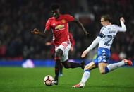 MANCHESTER, ENGLAND - JANUARY 29: Axel Tuanzebe of Manchester United is tackled by Stephen Warnock of Wigan Athletic during the Emirates FA Cup Fourth round match between Manchester United and Wigan Athletic at Old Trafford on January 29, 2017 in Manchester, England. (Photo by Gareth Copley/Getty Images)