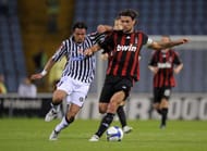 UDINE, ITALY - MAY 05: Simone Pepe of Udinese is held off by Paolo Maldini of AC Milan in action during the Serie A match between Udinese and AC Milan at the Stadio Friuli on May 16, 2009 in Udine, Italy. (Photo by New Press/Getty Images)