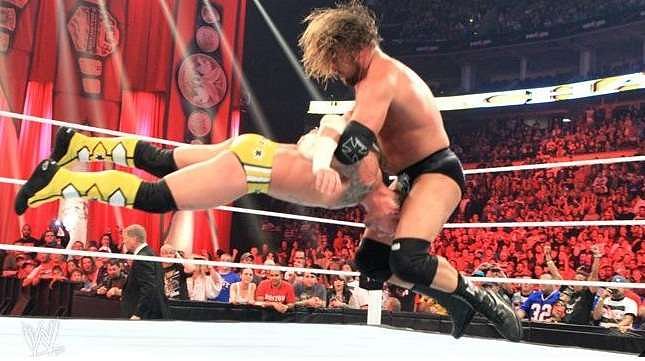 Triple H delivering the pedigree to CM Punk at Night of Champions 2011