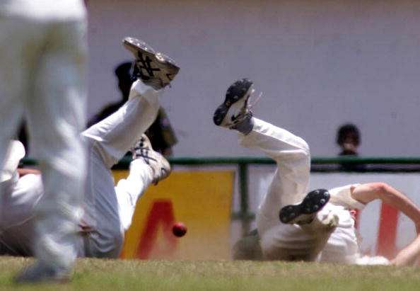 Jason Gillespie and Steve Waugh of Australia collide while attempting to take a catch