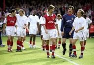 16 May 1999: Tony Adams, David Seaman and Lee Dixon of Arsenal console each other after the FA Carling Premiership match against Aston Villa played at Highbury in London, England. The match finished in a 1-0 victory for Arsenal, however, they were unable to clinch the Premiership title. \ Mandatory Credit: Ross Kinnaird /Allsport