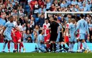 MANCHESTER, ENGLAND - MAY 13: Joey Barton of QPR clashes with Sergio Aguero of Manchester City after being shown the red card by Referee Mike Dean during the Barclays Premier League match between Manchester City and Queens Park Rangers at the Etihad Stadium on May 13, 2012 in Manchester, England. (Photo by Shaun Botterill/Getty Images)