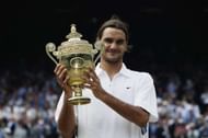 LONDON - JULY 6: Roger Federer of Switzerland holds the trophy after his victory over Mark Philippoussis of Australia in the Men's Singles Final during the final day of the Wimbledon Lawn Tennis Championships held on July 6, 2003 at the All England Lawn Tennis and Croquet Club, in Wimbledon, London. (Photo by Alex Livesey/Getty Images)