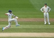 MELBOURNE, AUSTRALIA - DECEMBER 28: Virat Kohli (L) of India leaps as he celebrates after reaching his century as Steven Smith of Australia looks on during day three of the Third Test match between Australia and India at Melbourne Cricket Ground on December 28, 2014 in Melbourne, Australia. (Photo by Scott Barbour/Getty Images)