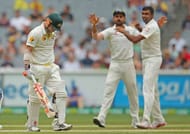 MELBOURNE, AUSTRALIA - DECEMBER 29: Ravichandran Ashwin of India celebrates with Virat Kohli after dismissing David Warner of Australia during day four of the Third Test match between Australia and India at Melbourne Cricket Ground on December 29, 2014 in Melbourne, Australia.. (Photo by Scott Barbour/Getty Images)