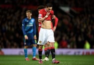 MANCHESTER, ENGLAND - MARCH 09: A dejected Angel di Maria of Manchester United walks off the pitch after receiving the red card from referee Michael Oliver during the FA Cup Quarter Final match between Manchester United and Arsenal at Old Trafford on March 9, 2015 in Manchester, England. (Photo by Michael Regan/Getty Images)