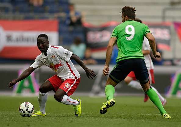 SALZBURG, AUSTRIA - JULY 11:  Naby Keita (L) of Salzburg and Jay Rodriguez (R) of Southampton fight for the ball during the pre-season match for the 3rd place between FC Red Bull Salzburg and Southampton FC as part of the Audi Quattro Cup 2015 at Red Bull Arena on July 11, 2015 in Salzburg, Austria.  (Photo by Johannes Simon/Getty Images)