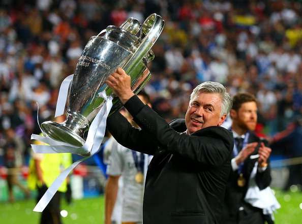 LISBON, PORTUGAL - MAY 24:  Head Coach, Carlo Ancelotti of Real Madrid celebrates with the Champions League trophy during the UEFA Champions League Final between Real Madrid and Atletico de Madrid at Estadio da Luz on May 24, 2014 in Lisbon, Portugal.  (Photo by Alex Livesey/Getty Images)