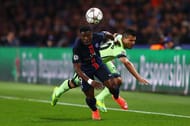 PARIS, FRANCE - APRIL 06: Serge Aurier of Paris Saint-Germain and Sergio Aguero of Manchester City compete for the ball during the UEFA Champions League Quarter Final First Leg match between Paris Saint-Germain and Manchester City at Parc des Princes on April 6, 2016 in Paris, France. (Photo by Clive Rose/Getty Images)