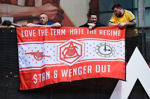 LONDON, UNITED KINGDOM - MAY 15:  Supporters hold a banner to protest against owner Stan Kroenke and manager Arsene Wenger prior to the Barclays Premier League match between Arsenal and Aston Villa at Emirates Stadium on May 15, 2016 in London, England.  (Photo by Mike Hewitt/Getty Images)
