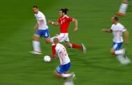 TOULOUSE, FRANCE - JUNE 20: Gareth Bale of Wales runs with the ball in the Russa defense during the UEFA EURO 2016 Group B match between Russia and Wales at Stadium Municipal on June 20, 2016 in Toulouse, France. (Photo by Ian Walton/Getty Images)