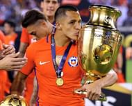 EAST RUTHERFORD, NJ - JUNE 26: Alexis Sanchez #7 of Chile kisses the trophy after the win over Argentina during the Copa America Centenario Championship match at MetLife Stadium on June 26, 2016 in East Rutherford, New Jersey.Chile defeated Argentina 0-0 with the 4-2 win in the shootout. (Photo by Elsa/Getty Images)