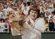 Jimmy Connors of the United States holds the trophy at winning the Men's Singles Final match against Ken Rosewall at the Wimbledon Lawn Tennis Championship on 6 July 1974 at the All England Lawn Tennis and Croquet Club in Wimbledon in London, England. (Photo by Keystone/Getty Images)