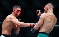 LAS VEGAS, NV - AUGUST 20: Nate Diaz (L) throws a right at Conor McGregor during their welterweight rematch at the UFC 202 event at T-Mobile Arena on August 20, 2016 in Las Vegas, Nevada. McGregor won by majority decision. (Photo by Steve Marcus/Getty Images)