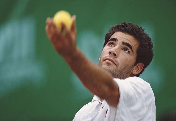 Pete Sampras of the United States serves to Michael Chang during their Men's Singles Final match of the Salem OpenTennis Championship on 14 April 1996 at the outdoor hard courts on Hong Kong Island in Hong Kong . (Photo by Gary M. Prior/Getty Images)