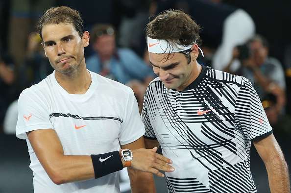 MELBOURNE, AUSTRALIA - JANUARY 29: Roger Federer of Switzerland (R) celebrates winning in the Men's Final match against Raphael Nadal of Spain on day 14 of the 2017 Australian Open at Melbourne Park on January 29, 2017 in Melbourne, Australia. (Photo by Michael Dodge/Getty Images)