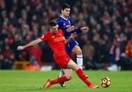 LIVERPOOL, ENGLAND - JANUARY 31: Jordan Henderson of Liverpool and Marcos Alonso of Chelsea compete for the ball during the Premier League match between Liverpool and Chelsea at Anfield on January 31, 2017 in Liverpool, England. (Photo by Clive Mason/Getty Images)