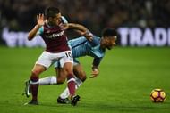 STRATFORD, ENGLAND - FEBRUARY 01: Manuel Lanzini of West Ham United is challenged by Raheem Sterling of Manchester City during the Premier League match between West Ham United and Manchester City at London Stadium on February 1, 2017 in Stratford, England. (Photo by Mike Hewitt/Getty Images)